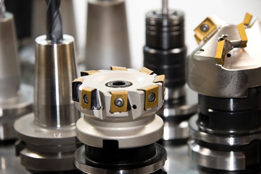 CNC tool holders with face mills, drills, and end mills